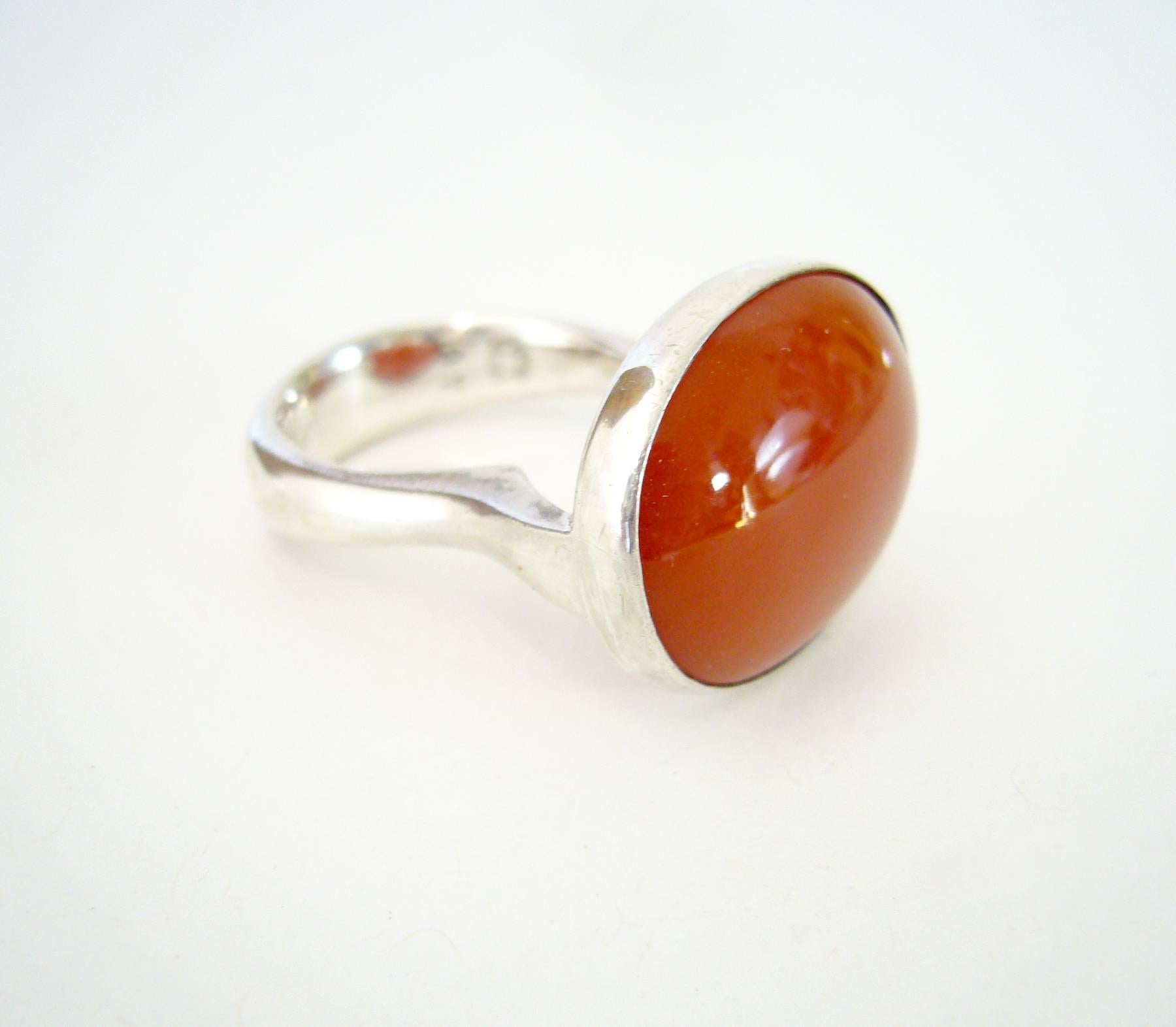 Rare, Danish modernist sterling silver and carnelian ring designed by Nanna and Jorgen Ditzel for Georg Jensen.  Ring is a finger size 8 - 8.5 and signed Georg Jensen, 925S, 97, Sterling, Denmark.  In very good vintage condition.  