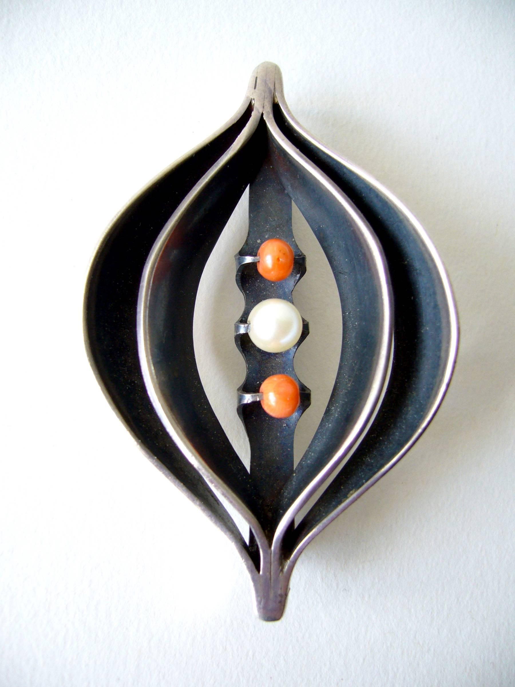 American modernist sterling silver, coral and pearl pendant or brooch created by Ronald Pearson of  Rochester, New York.  Piece measures 2 3/4
