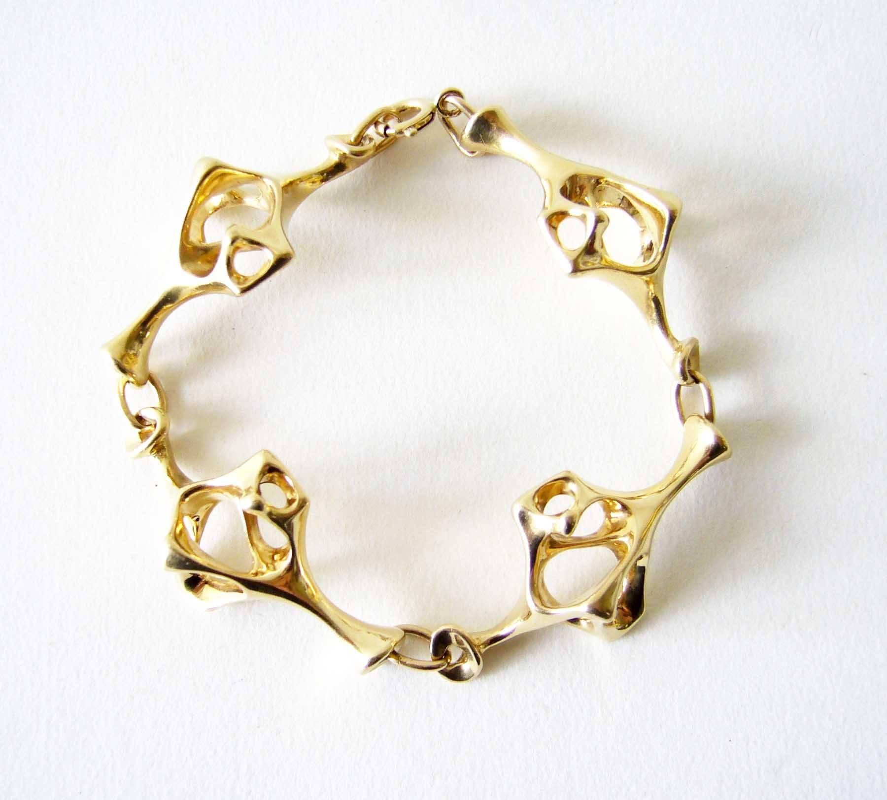 14k gold skeletal link surrealist bracelet created by jeweler Everett MacDonald of Laguna Beach, California.  MacDonald is known for his exceptional jewelry making and sculpture.  He exhibited in the California Design 11 show at the Pasadena Art