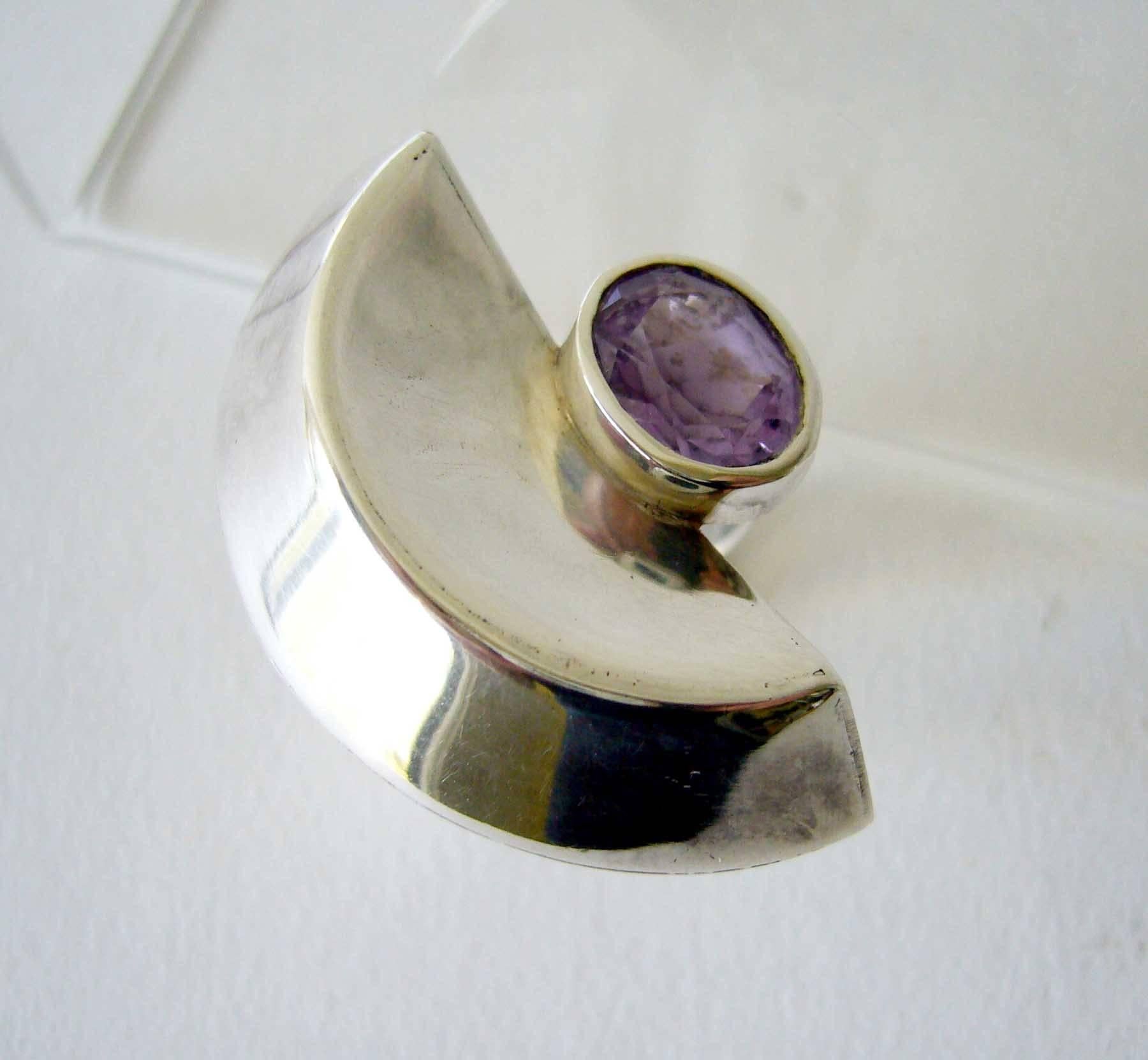 1970's sterling silver ring with faceted amethyst stone created by French jeweler Suzanne Somogy.  Ring is a finger size 6.5 and its face measures 1 3/8