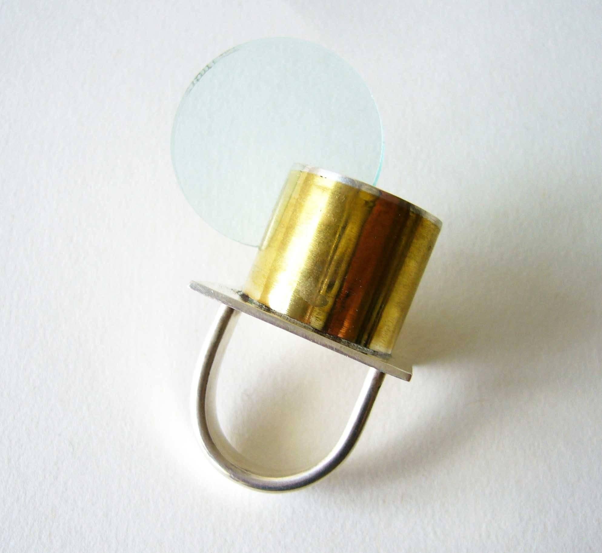 Sterling silver, brass and acrylic disc ring, part of a new Post Modernist series from Heidi Abrahamson of Phoenix Arizona. Ring is a finger size 7 to 7.25 and is signed Heidi, .925 and in excellent condition.  