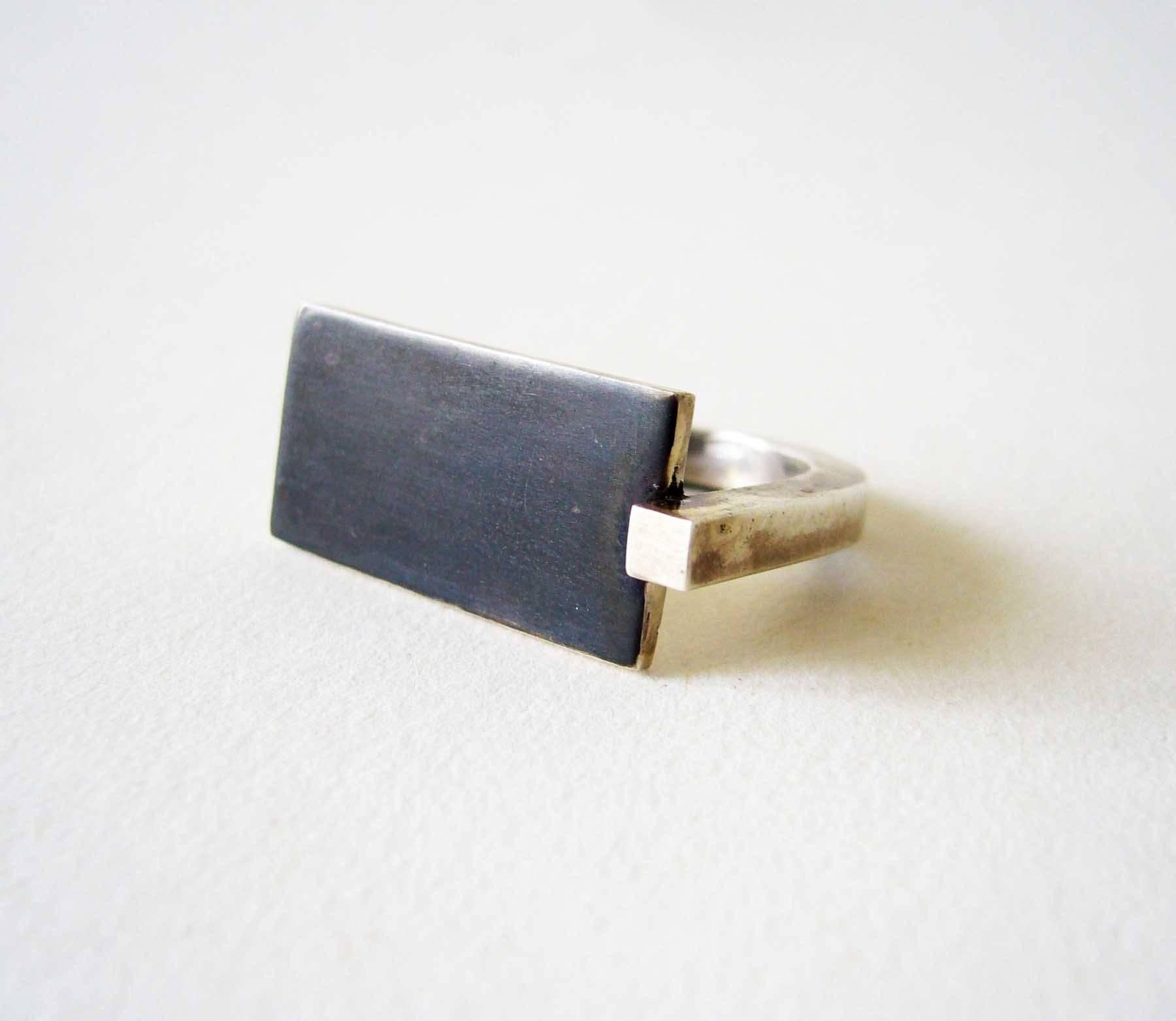 Oxidized sterling silver minimalist ring created by Heidi Abrahamson of Phoenix, Arizona.  Ring features a square sterling silver 