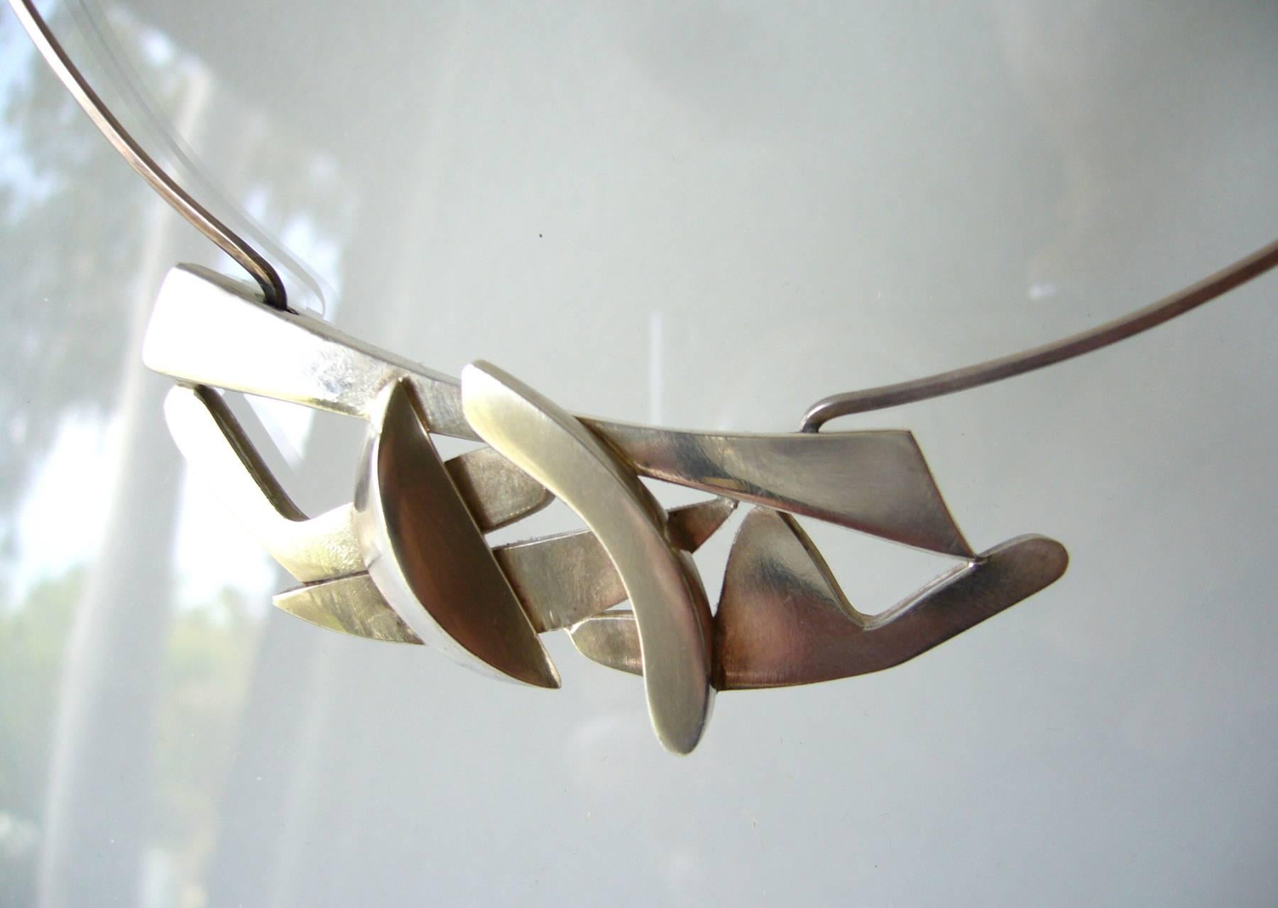 Sterling silver abstract modern choker necklace created by Suzanne Somogy of Paris, France.  Necklace has 16.5