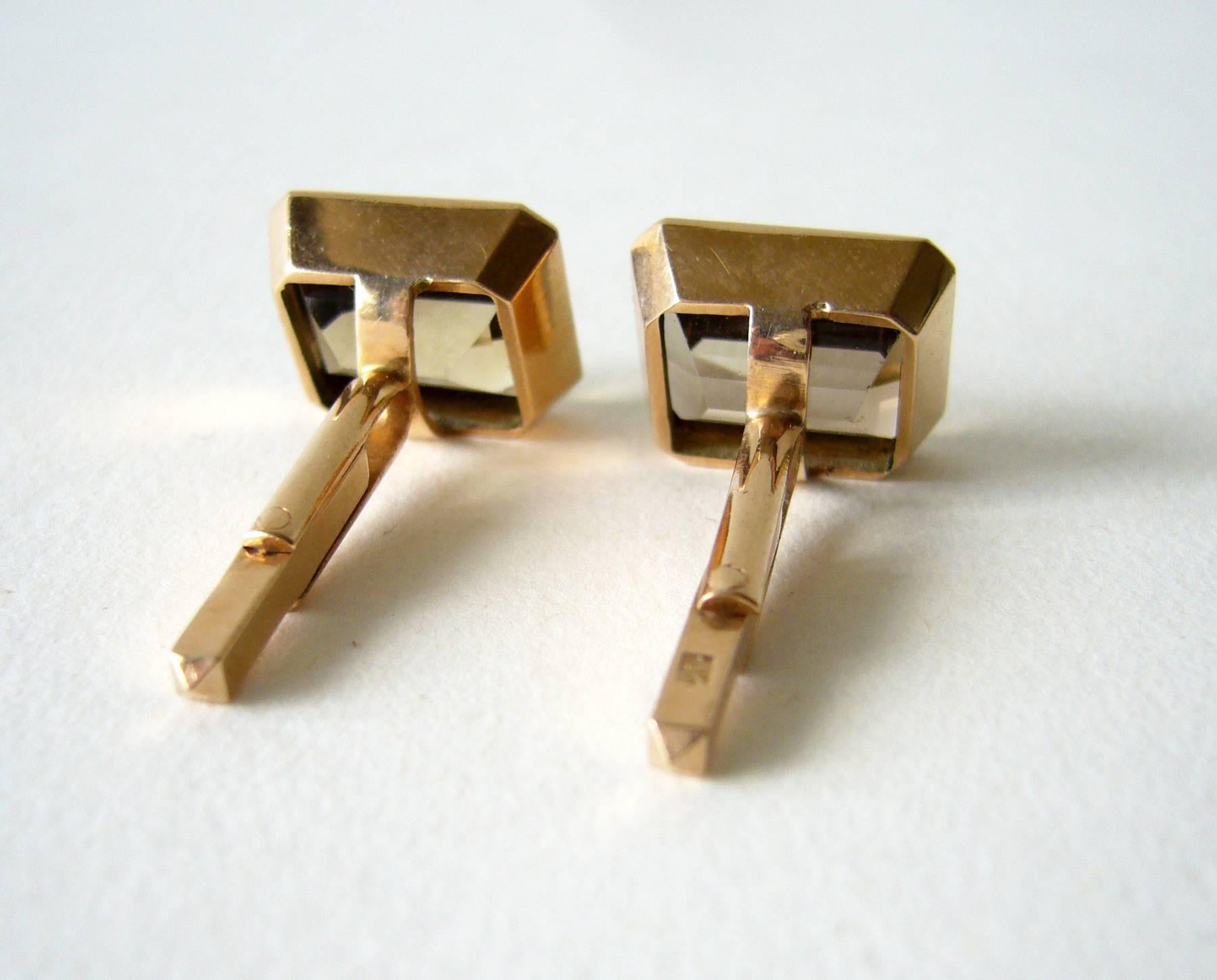 Pair of 14k rose gold and faceted smokey quartz cufflinks circa 1960's.  Cufflinks measure .75" by .50".  Signed 14k on findings and in very good vintage condition.   