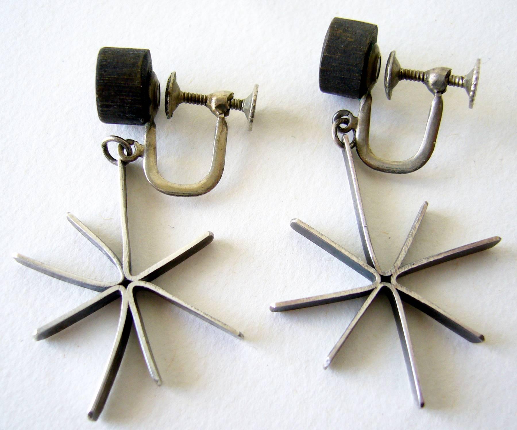 Sterling silver and wood starburst earrings by Betty Cooke of Baltimore, Maryland. Earrings measure about 2" in length and or of the screwback variety.  Unsigned and in very good vintage condition.  