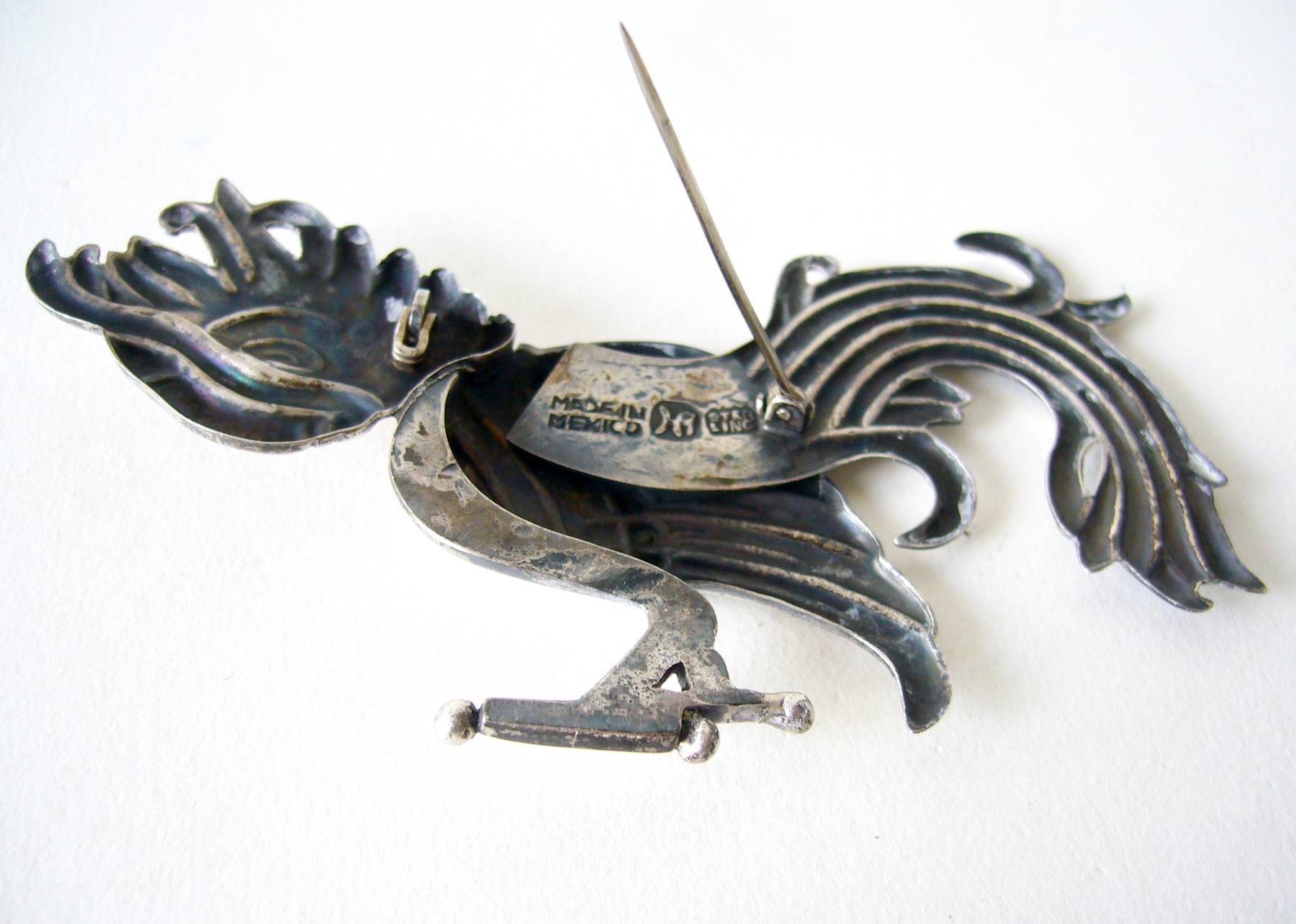 Large scale sterling silver parrot brooch created by Hector Aguilar of Taxco, Mexico.  Aguilar apprenticed under master jeweler William Spratling.  Brooch measures 2.5