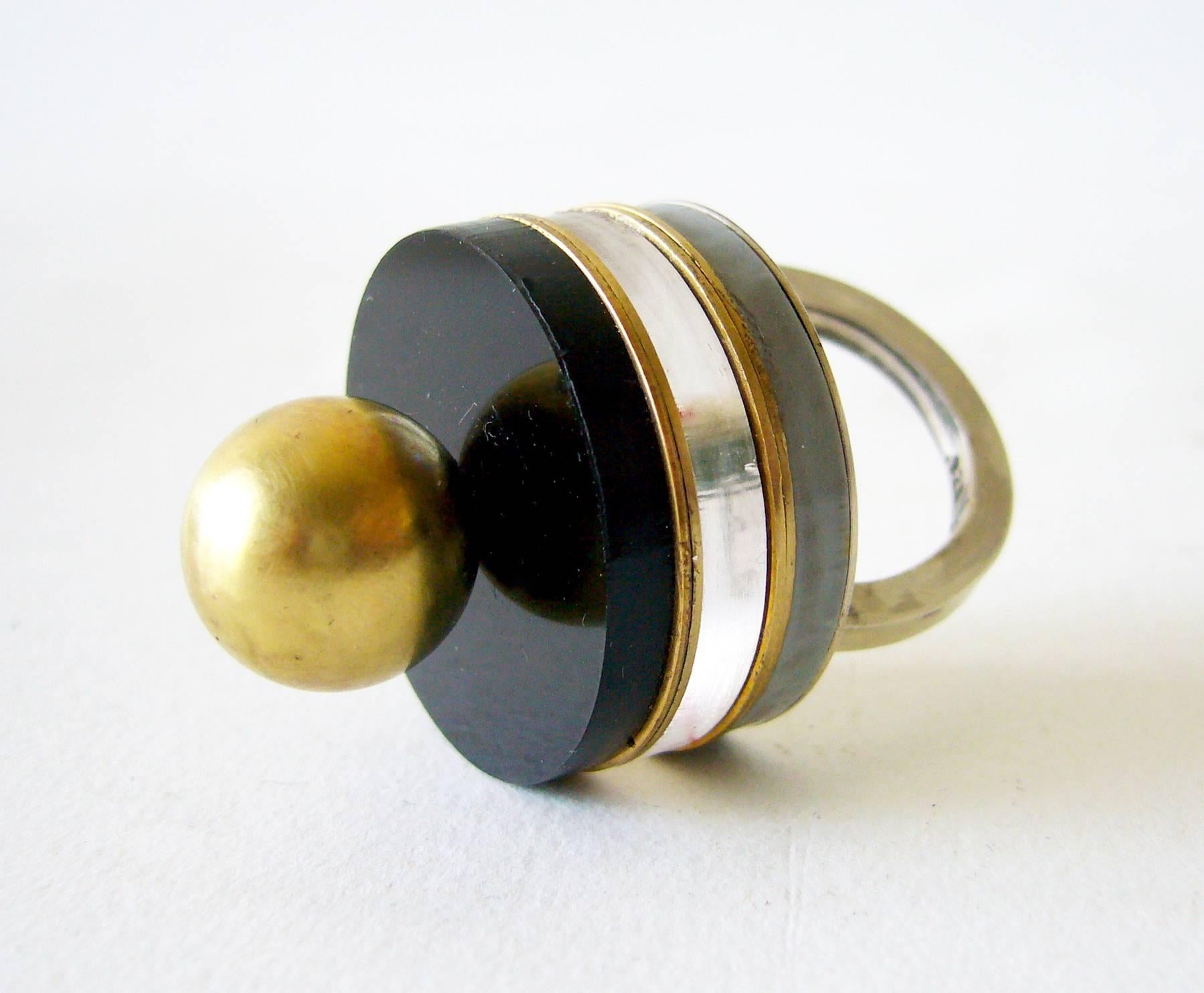 Sterling silver, brass and acrylic post modernist ring created by Heidi Abrahamson of Phoenix, Arizona.  Ring is a finger size 6.5 - 6.75 and stands 1 1/8" off the finger.  Signed Heidi, .925.  In excellent condition.  