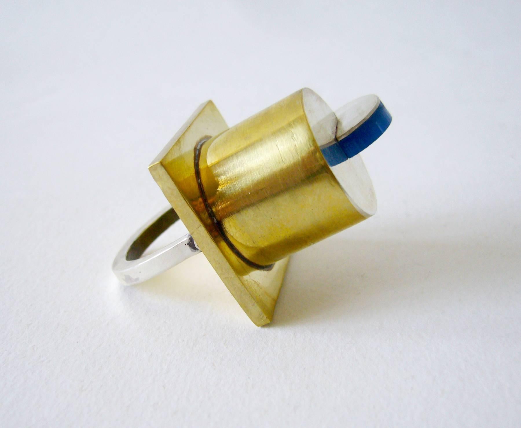 Post Modernist style ring of sterling silver, brass and acrylic designed and created by Heidi Abrahamson.  Ring measures a finger size 7 but can fit up to a 7.25 due to its design.  It sits 1