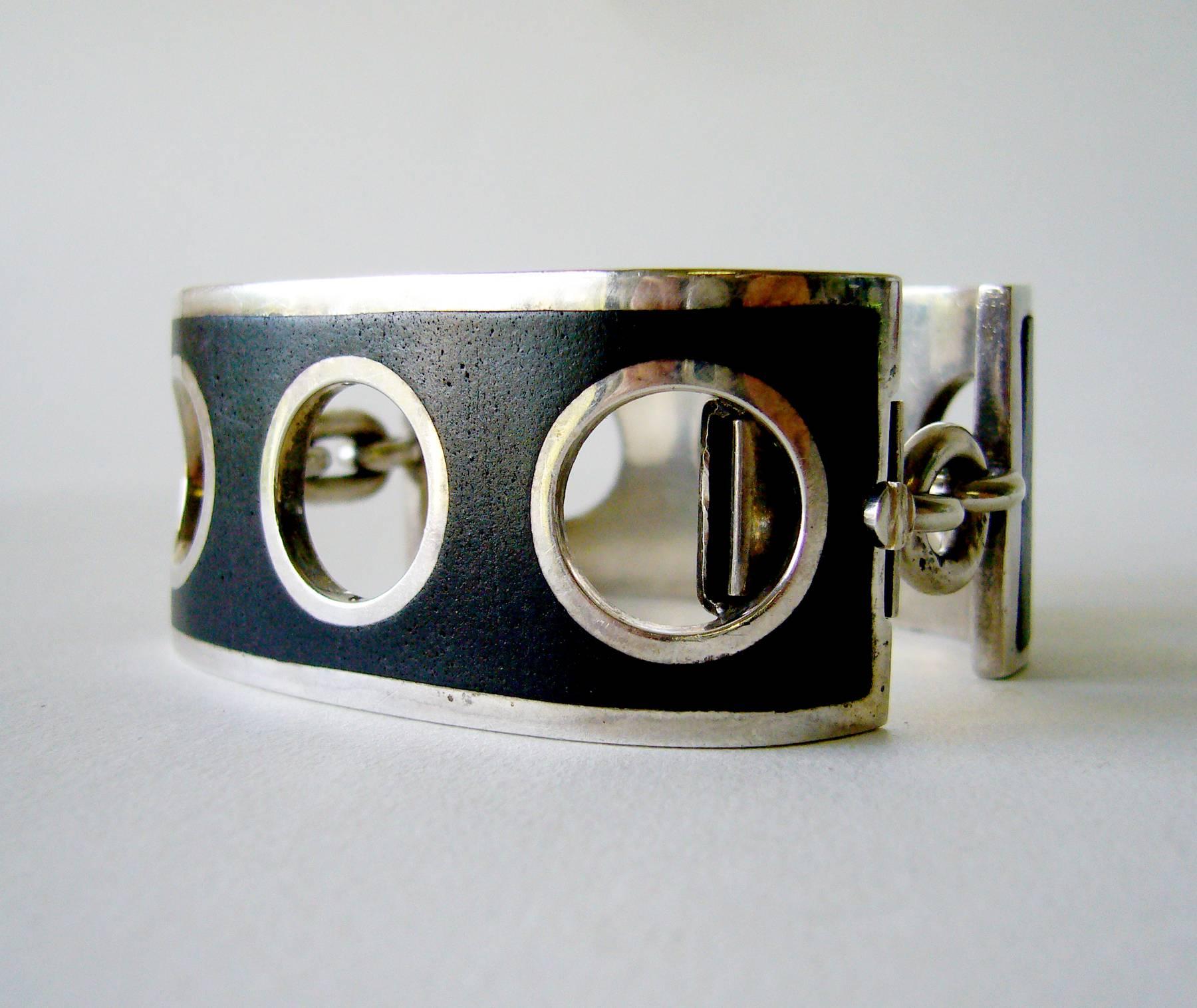 Sterling silver with black inlay shackle bracelet designed and created by José Maria Puig Doria of Spain.  Bracelet has a bold, geometric design and has very good weight.  For a smaller sized wrist, inner circumference being 6.5