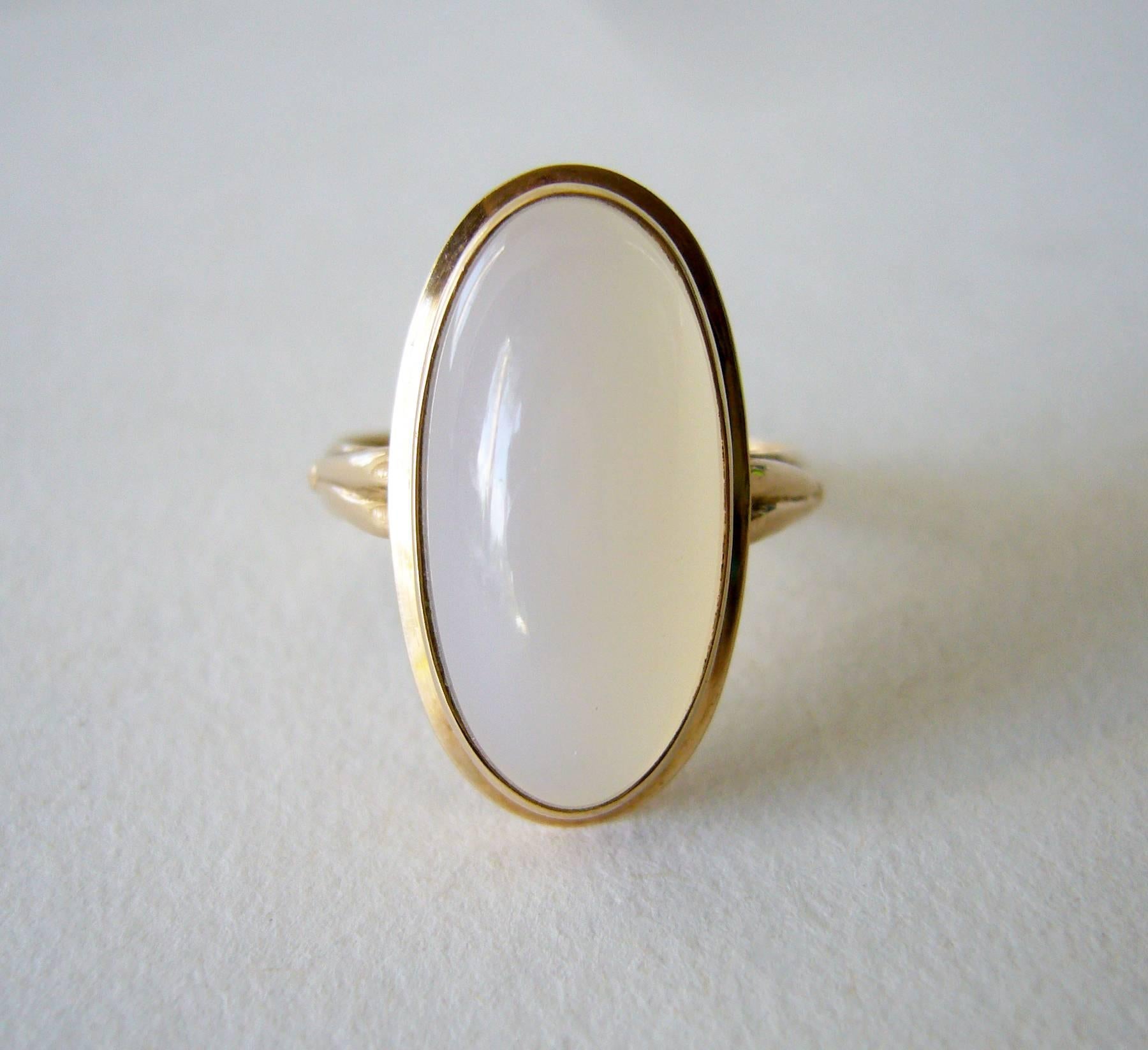 Finnish modernist 14k gold set with large moonstone cabochon, circa 1959. Ring is a finger size 8.25 to 8.5 and is signed HJR, Finnish Hallmarks, 585, F7 (1959).  Ring is suitable for a modern day version of a wedding or engagement ring.  In