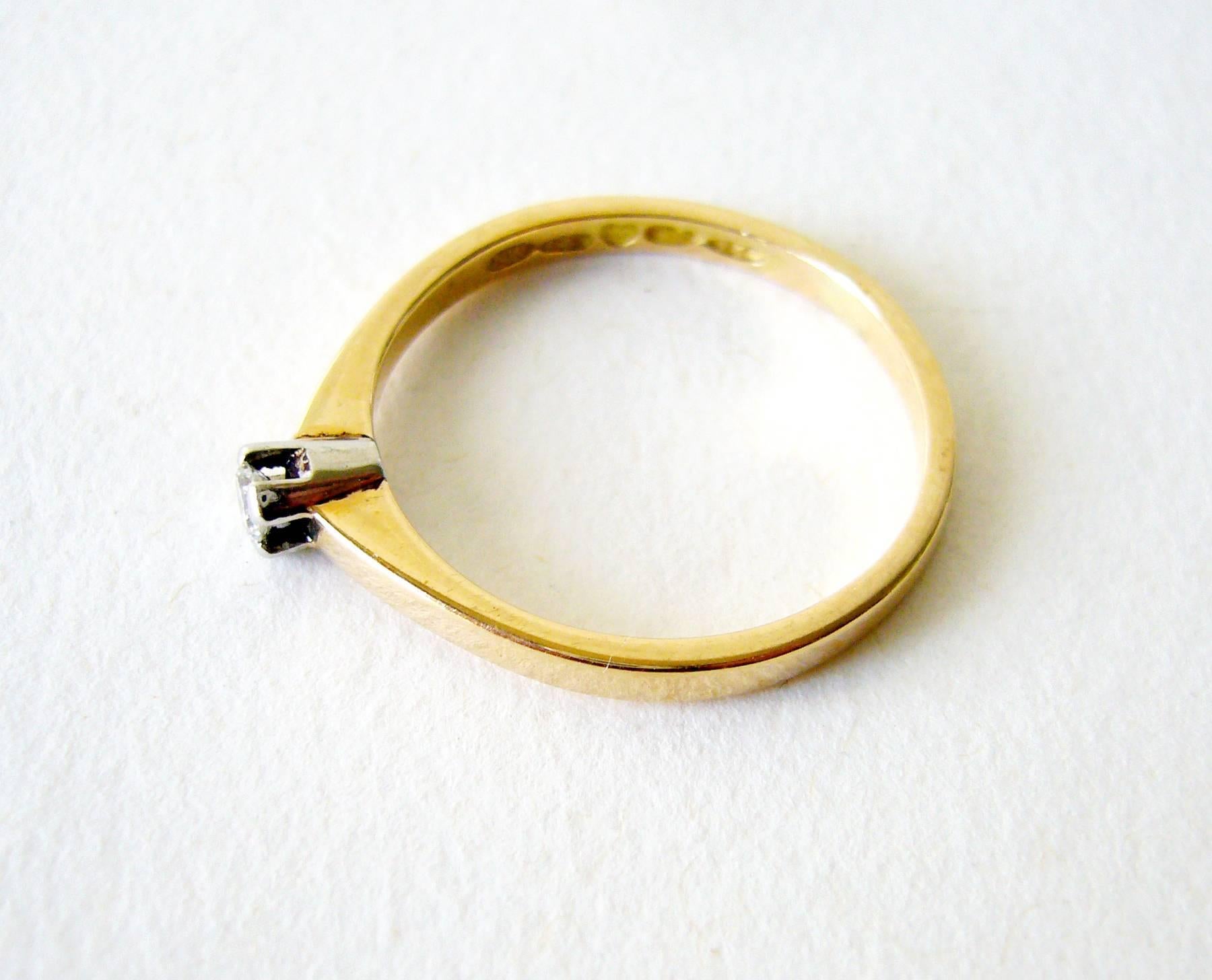 Finnish modern engagement ring of 18k yellow and white gold created by Nils Westerback of Finland.  Ring is a finger size 6.75 and is signed NW, 750, T7 (1972), Finnish Crown Hallmark.  In very good vintage condition.  2.4 grams.  