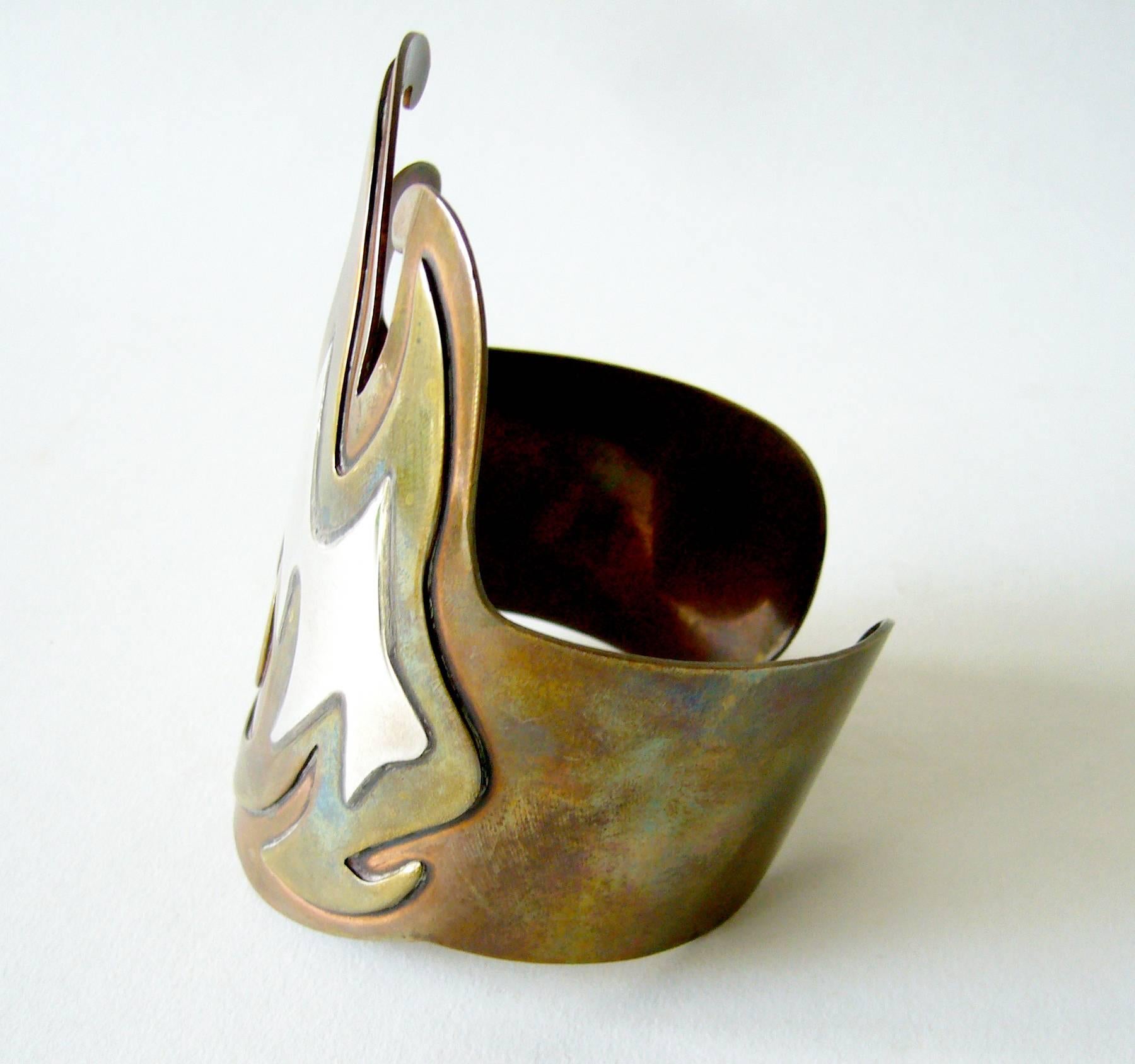 Large scale Mexican modern copper, brass and silver bracelet with flame design.  Bracelet is suitable for a large wrist on a man or for a mid or upper arm on a woman depending on the arm size.  It measures about 9