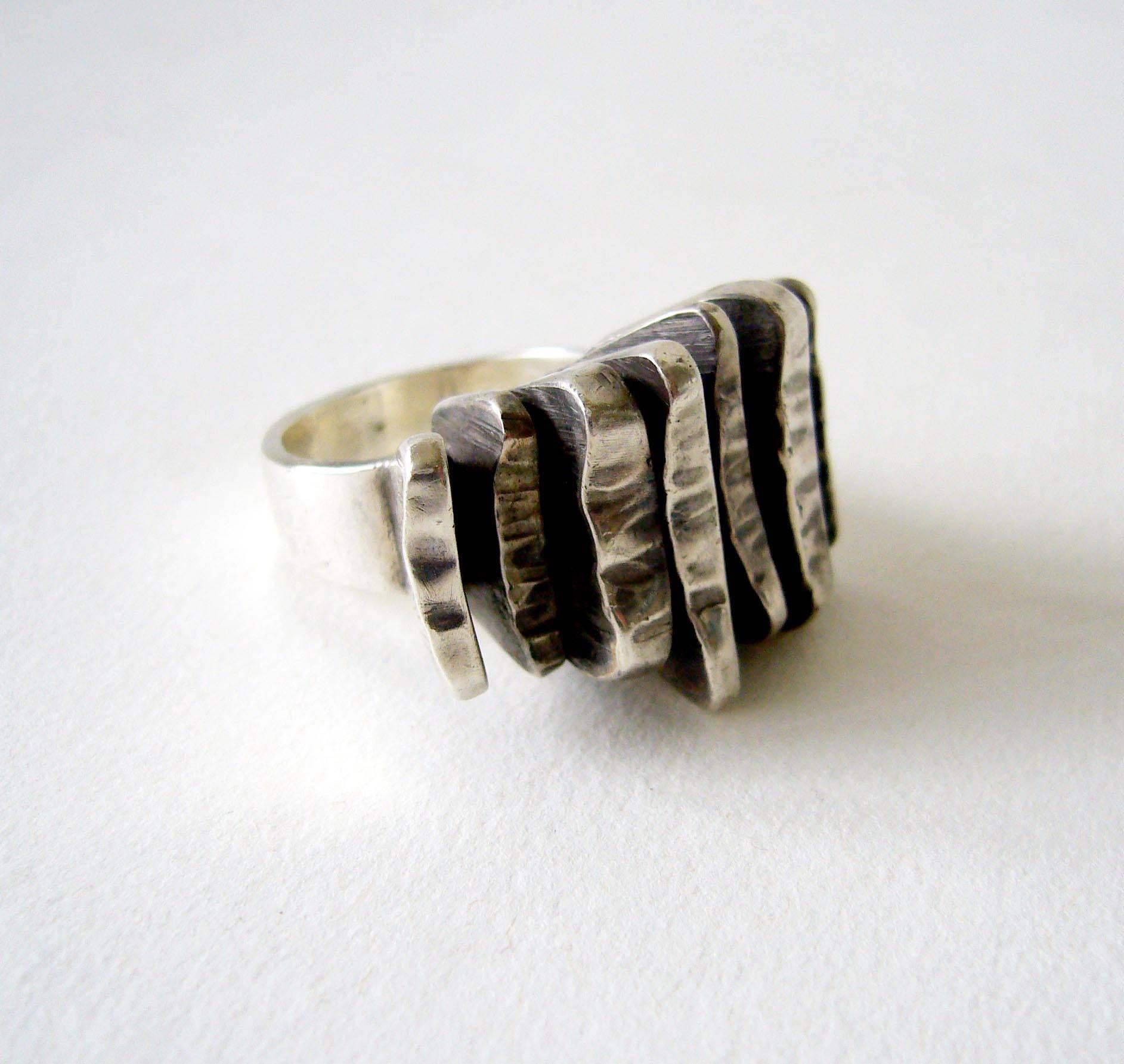 Heavy metal ring by Rey Urban for the Danish firm Aage Fausing, circa 1970's.  Ring is a finger size 7.25 and is signed A. Fausing, 925, Denmark on the inside shank.  In very good vintage condition.  
