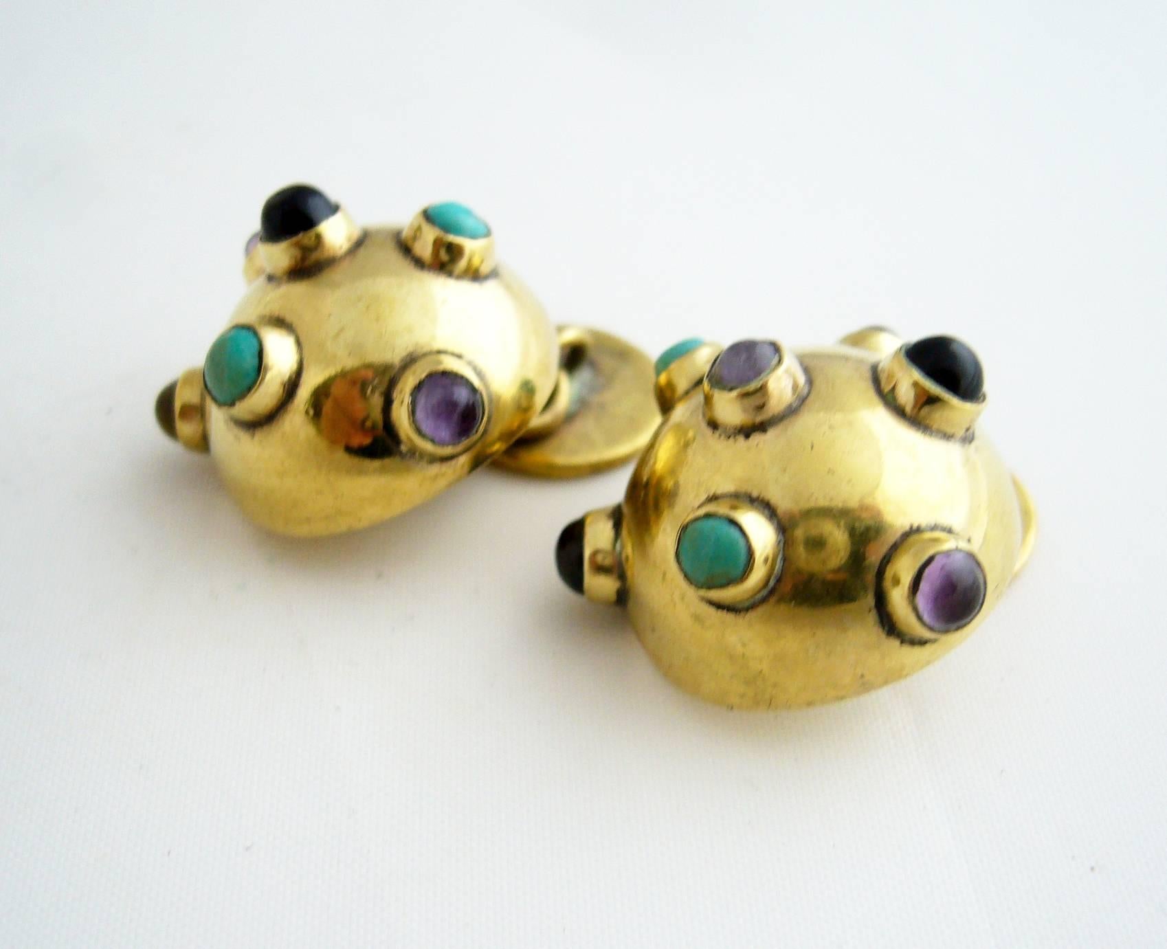 1950's sputnik style cufflinks by Hubert Harmon of Mexico.  Cufflinks are comprised of onyx, jade and amethyst cabochon gemstones set on brass domes.  Measuring 3/4