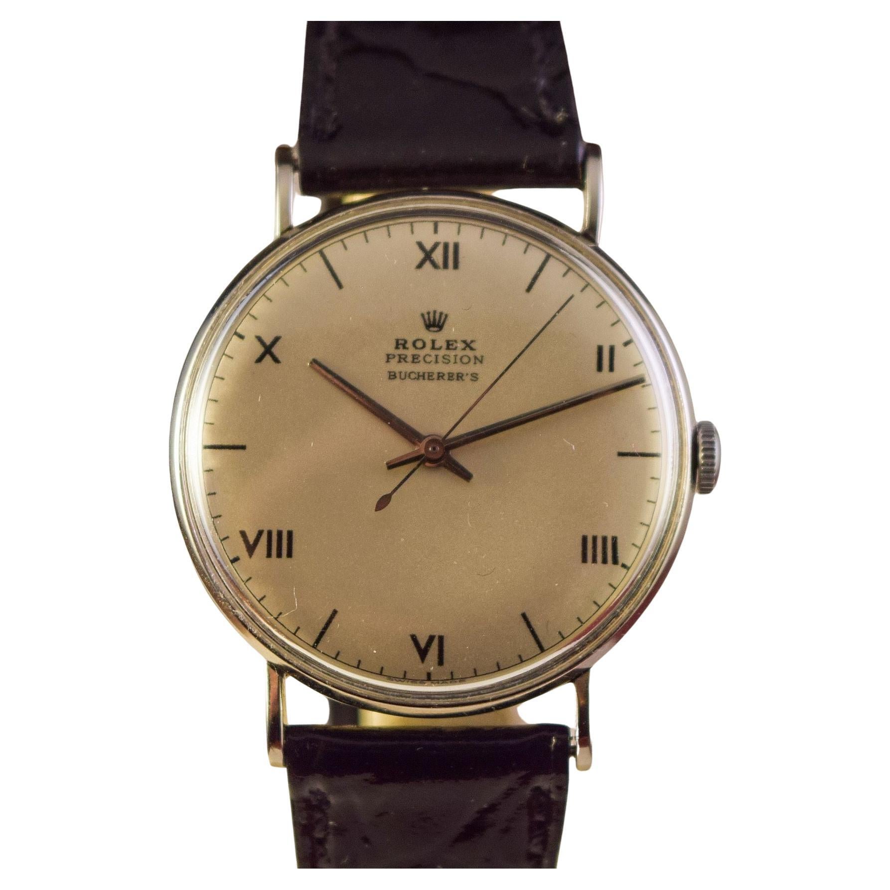 Very Elegant early Rolex Steel Case.
This watch is from the 1940's retailed by Bucherer.
Attractive dial is Signed Rolex Precision Bucherer's
Fine Black Roman Numerals and markers.
Steel Hands and Center second hand.
Manual winding