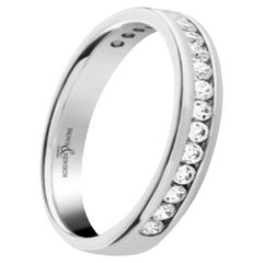 Bracelet artisanal en platine serti d'un diamant de 0,30 carat dans un anneau serti de rail