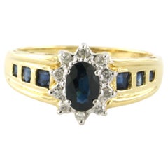 Ring with sapphire and brilliant cut diamonds up to 0.12ct 18k bicolour gold