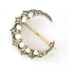 Brooch in shape of moon with pearl and rose cut diamonds 14k gold and silver