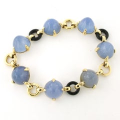 Braccialetto con calcedonio blu e onice, lungo 17,5 cm, 28,0 grammi, oro 18 carati