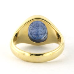 Signet ring with synthetic sapphire engraved with a family crest 18k gold