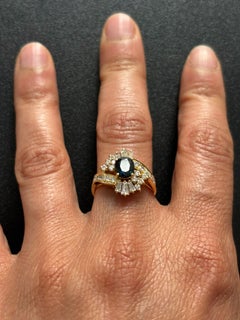Ring with sapphire, taper and brilliant cut diamonds up to 0.75ct 18k gold