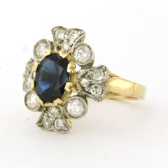 Ring with sapphire and brilliant cut diamonds up to 0.75ct 18k gold and silver