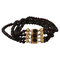 14k rose gold clasp with garnet on a four-row garnet bead bracelet 22.8 grams