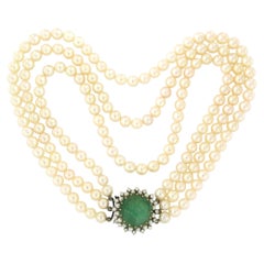 3 strand pearl necklace and 18k gold claps with emerald, pearl and diamonds