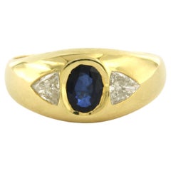 WEMPE 18k gold ring with sapphire 1.10ct and triangle cut diamond up to 0.80ct