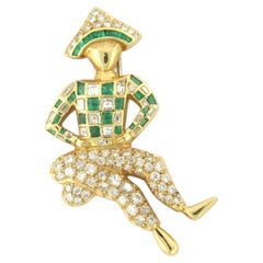 Harlequin-shaped brooch with emeralds, square cut and brilliant-cut diamonds