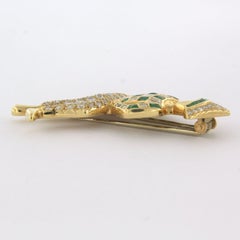 Harlequin-shaped brooch with emeralds, square cut and brilliant-cut diamonds