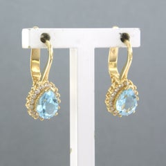Earrings with topaz and brilliant cut diamonds up to 0.32ct 18k gold 4.2 grams