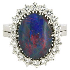 Carl F. Bucherer ring with opal and brilliant cut diamonds up to 1.50ct 18k gold