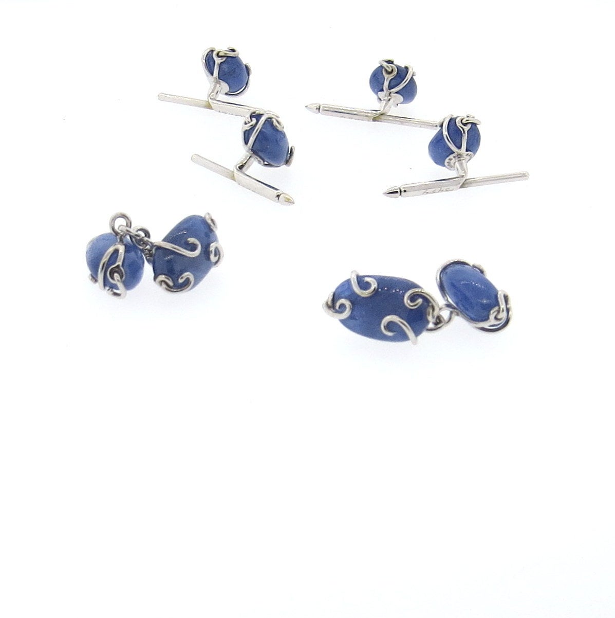 18k white gold cufflinks and studs set with sapphires.  The cufflinks measure 16.5mm x 9.5mm and the studs measure 13mm x 9mm.  The weight of the set 24.2 grams,