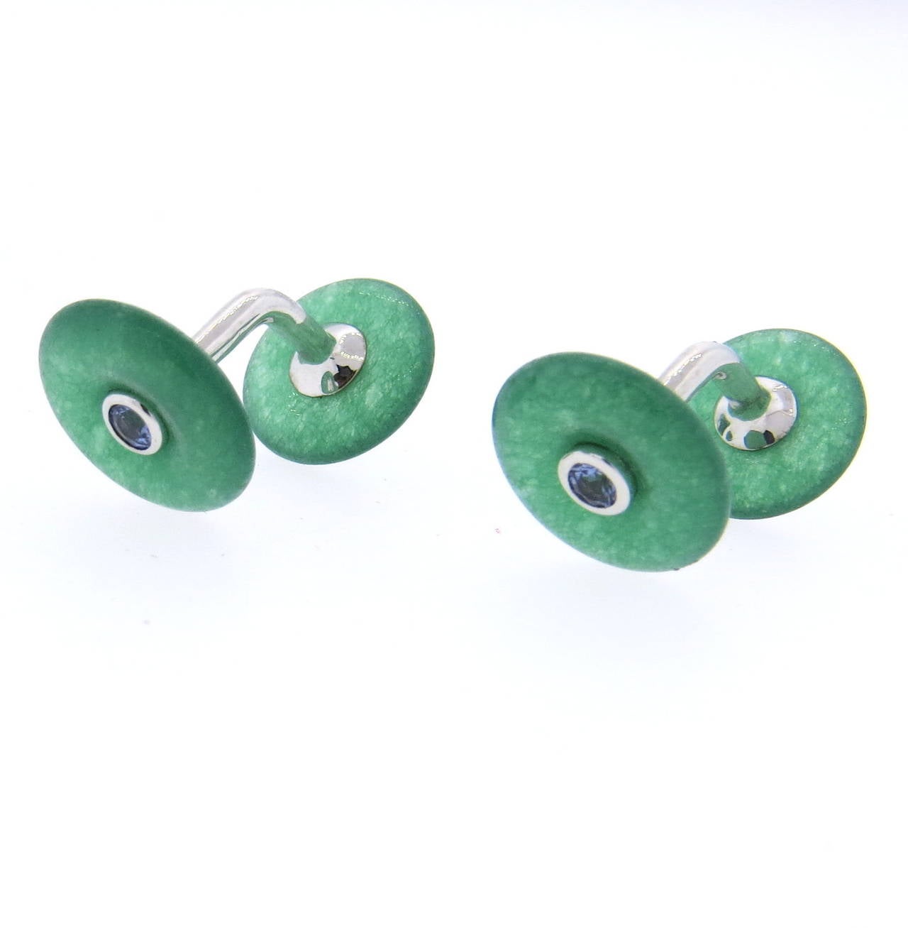 A pair of 18k white gold cufflinks set with chrysoprase and iolite.  Crafted by Trianon, the cufflinks measure 13.1mm and 11mm in diameter and weigh 5.7 grams.  Signed Trianon, 750, serial number.