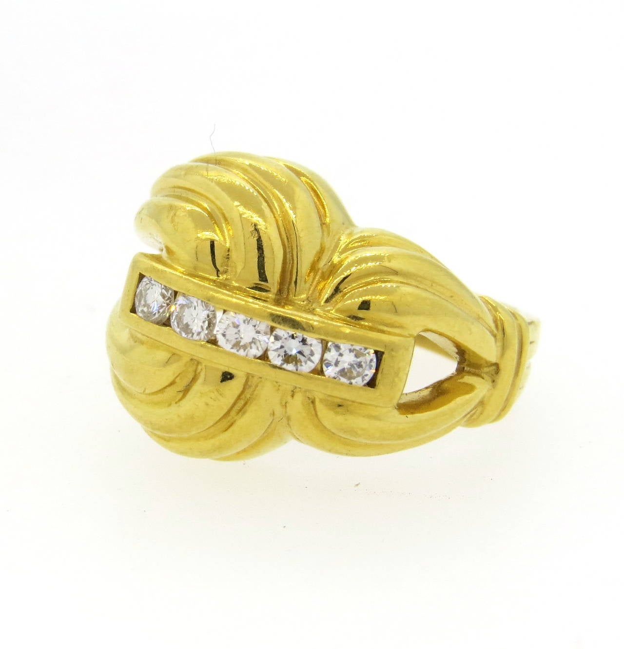 A 22k gold ring set with approx. 0.40cts in G/VS diamonds.  Crafted by Stephen Lagos, the ring is a size 6.25 and 16.5mm at the widest point.  The weight of the piece is 14.4 grams.