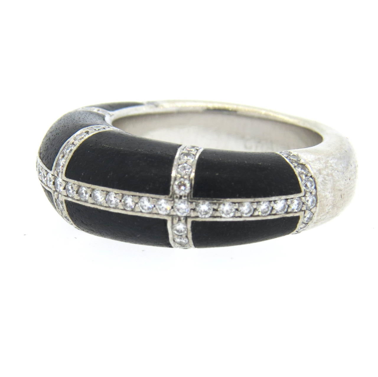 An 18k white gold ring set with Jet (Fossilized Wood) and approx. 0.70cts in G/VS diamonds. Crafted by Chaumet, the ring is a size 6 and is 8.5mm wide at the widest point.  The ring sits 6.5mm from the top of finger and weighs 13.7 grams.