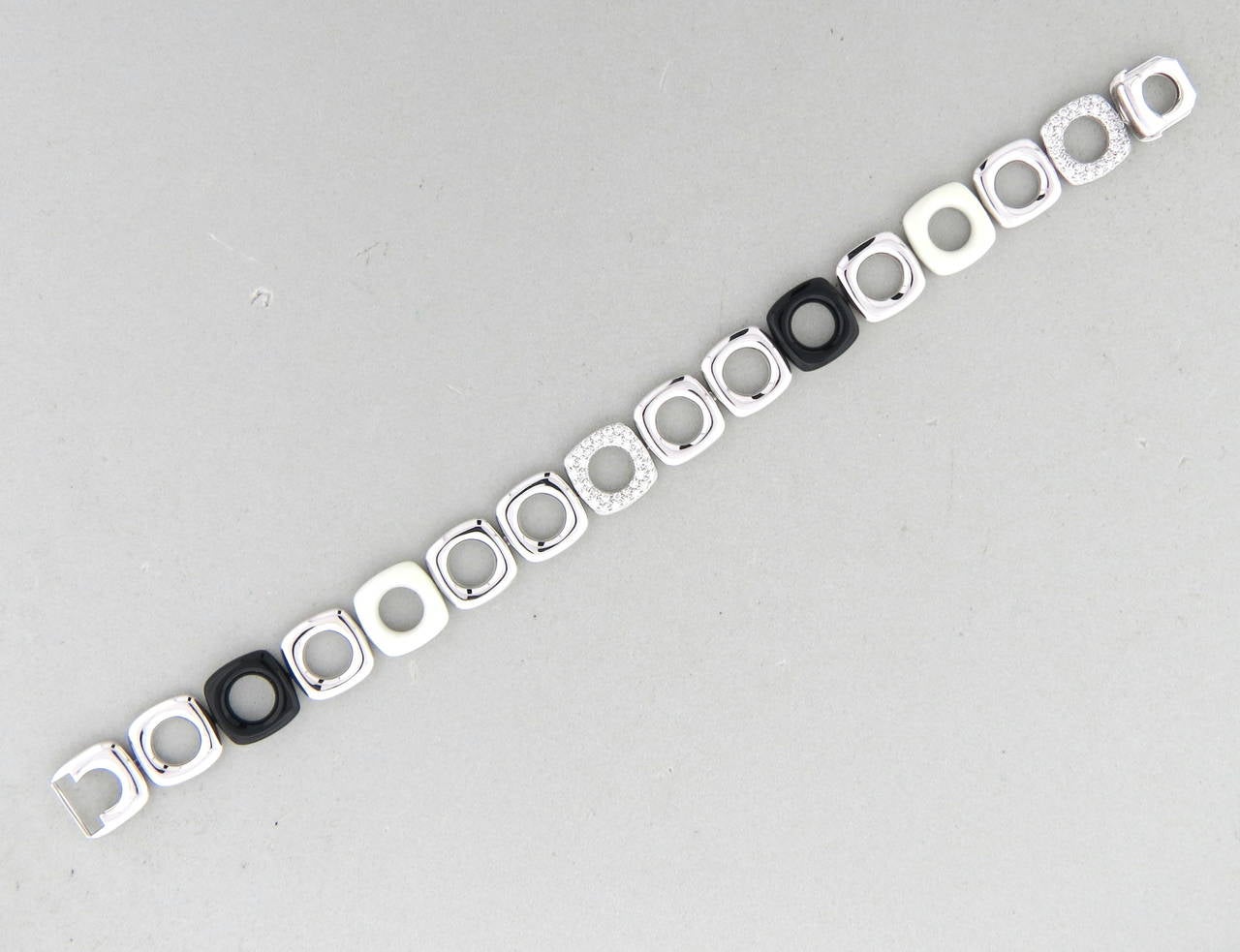 Tiffany & Co bracelet in 18k white gold, featuring diamond and white black hardstone links. Diamond weight is approx. 0.80ctw G/VS. Bracelet measures 7 1/4