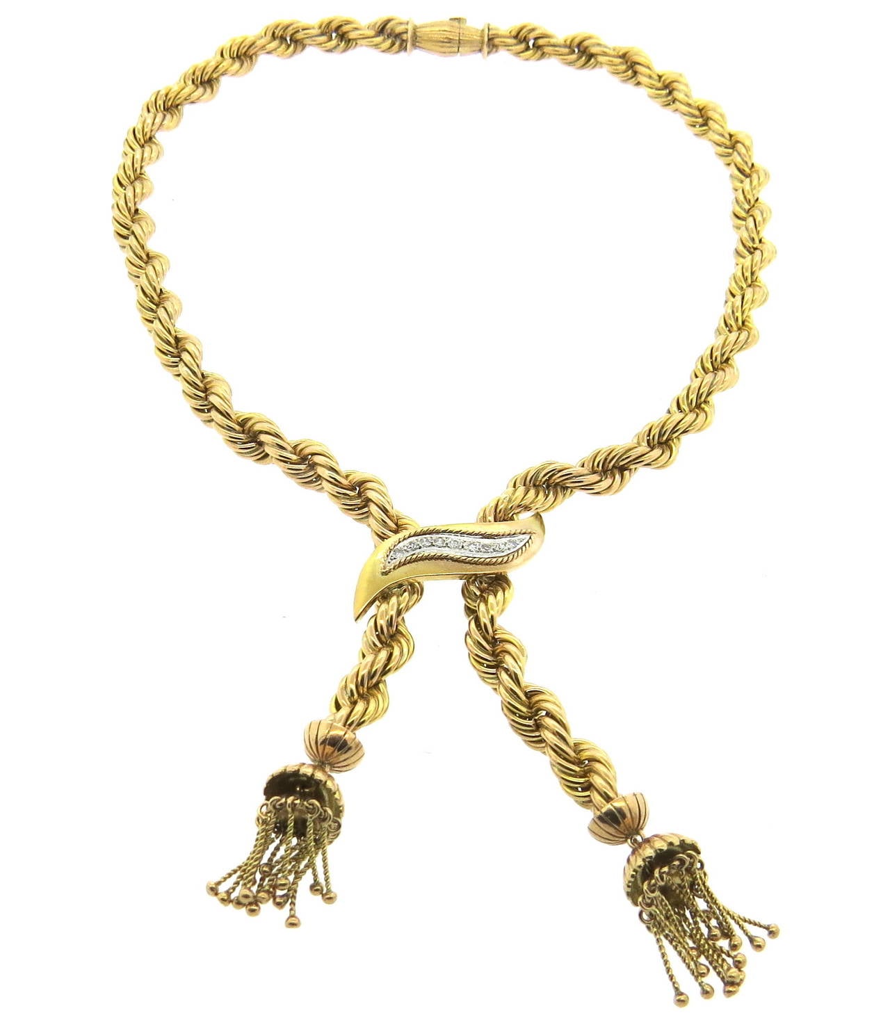 18k twisted pattern gold necklace, featuring approx. 0.20ctw in diamonds and two tassels. Necklace is 17