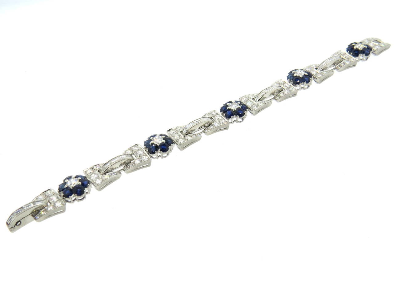 Circa 1950s platinum bracelet, set with approximately  9.50-10ctw in VS1-SI1/GH diamonds and approx. 5.00ctw in blue sapphires. Bracelet is 6 7/8