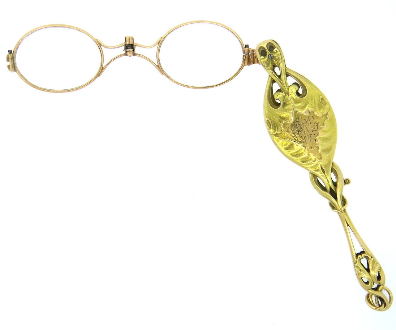 Art Nouveau 14k gold lorgnette, decorated with approximately 0.50ctw in diamonds. Measures 138mm incl. bale x 29mm. Weight of the piece - 60.6gr