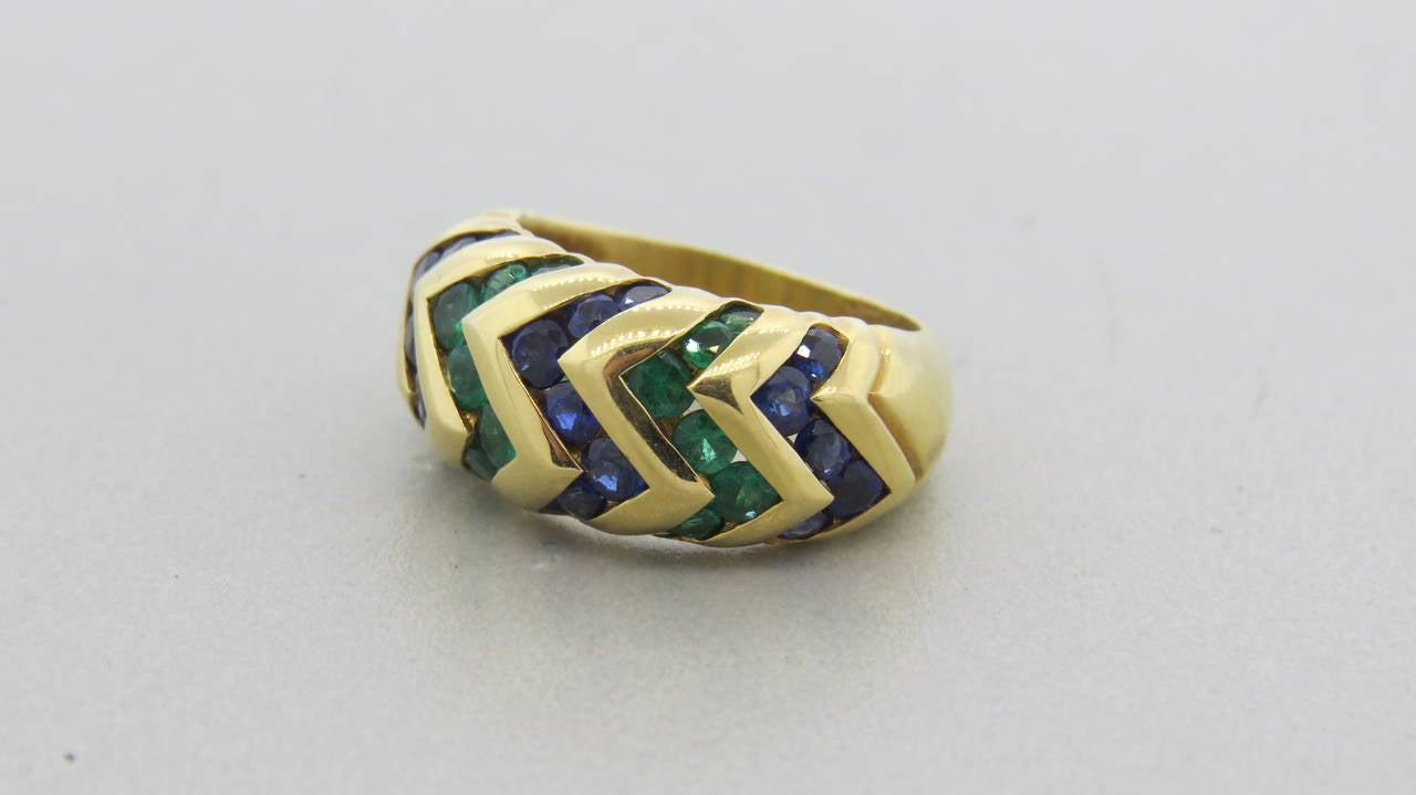 18k gold ring by Bulgari from Spiga collection, featuring sapphire and emerald strips. Ring size 6. Ring top is 10mm wide. Marked Bvlgari, 750. weight - 10gr