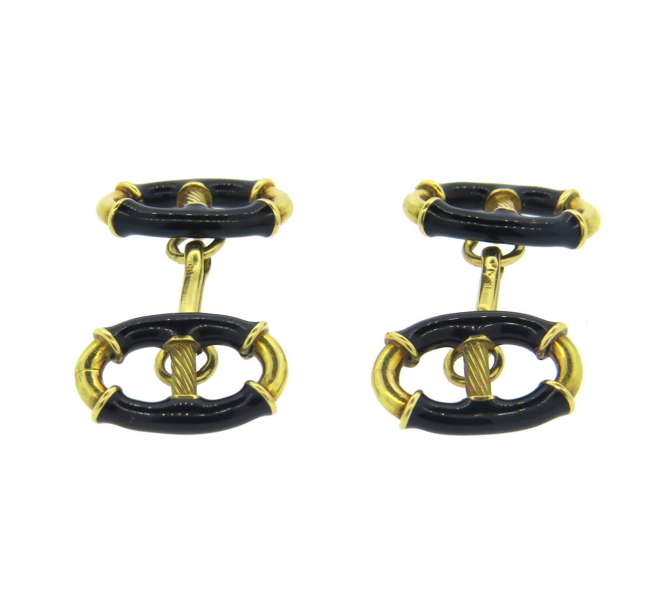 Retro mid century 18k gold  cufflinks, decorated with black enamel. Tops measure 17mm x 11. Weight - 14.9 grams