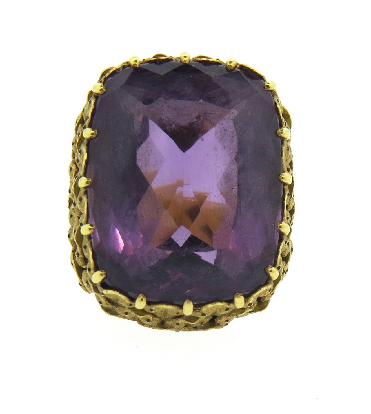 Circa 1960s ring, featuring approximately 27ct amethyst gemstone,set in beautifully hand engraved 18k gold setting. Ring size 5 1/2, ring top is 24mm x 20mm, ring sits approx. 11mm from the top of the finger. Weight of the piece - 22.4 grams