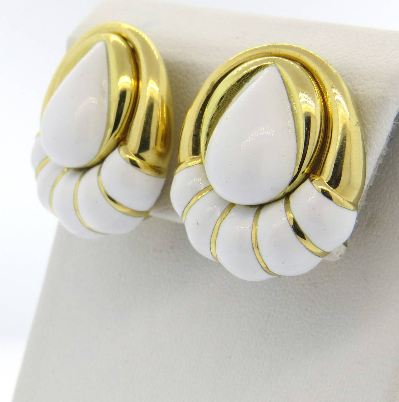 18k gold David Webb earrings decorated with white enamel. Earrings measure 27mm x 24mm. Marked Webb. Weight - 31.5 grams