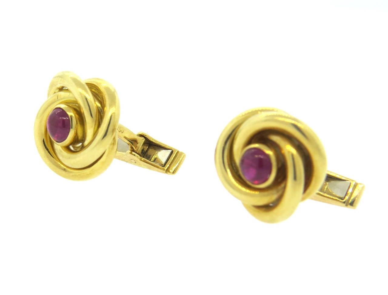 18k gold knot cufflinks, featuring 4.8mm ruby cabochons. Cufflink top is 15mm x 16mm. Weight - 14.8 grams