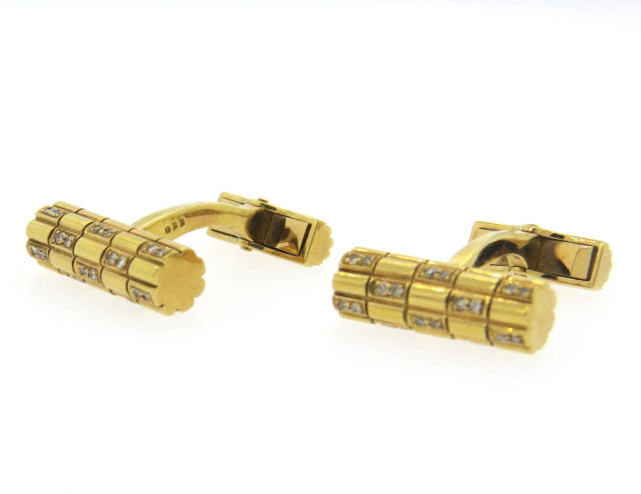 18k gold cufflinks set with diamonds. Top measures 18mm x 6mm. Weight - 12.7 grams
