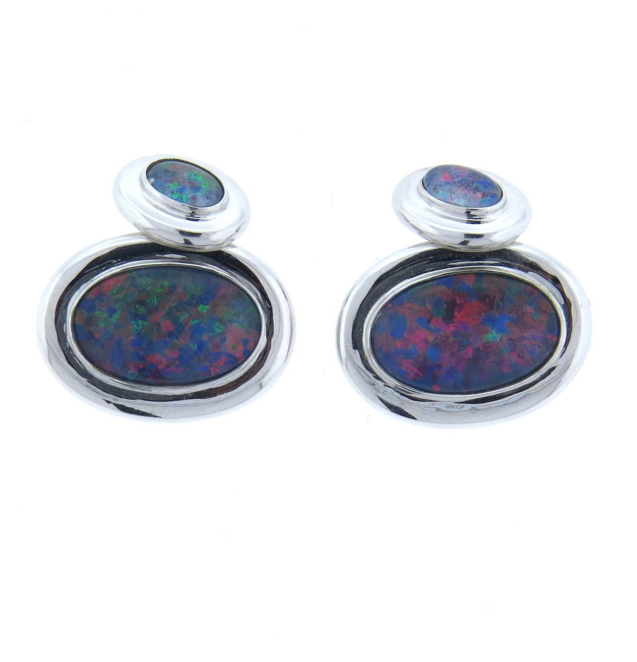 18k gold oval cufflinks, set with black opal doublets. Cufflink top measures 21mm x 16mm, back - 12mm x 9mm.  weight - 16.8 grams
