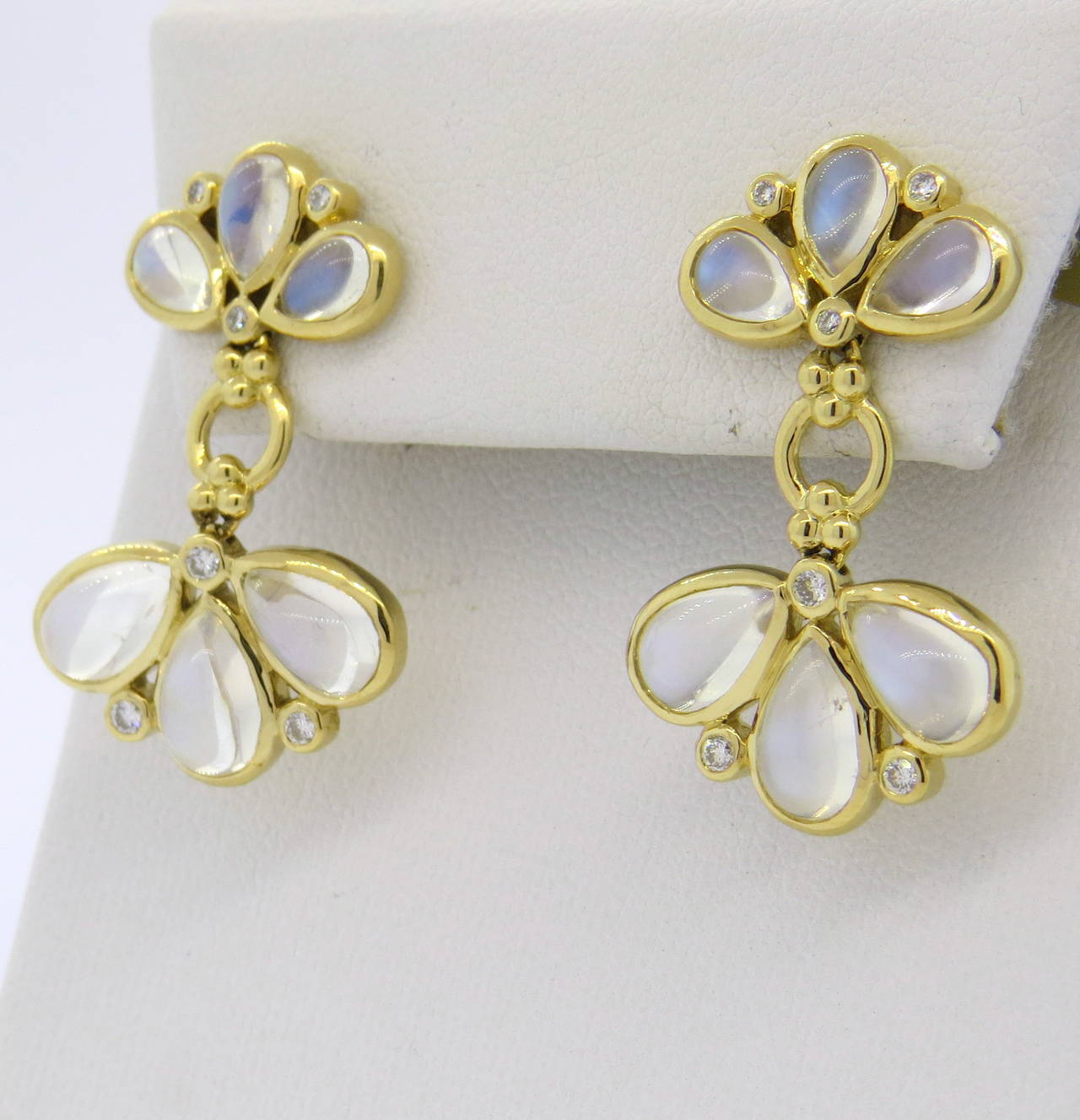 18k gold earrings by Temple St. Clair, set with approx. 0.21ctw in G/VS diamonds and moonstone cabochons, featuring fan drop design. Earrings measure 30mm x 20mm wide at widest point. Marked with Temple hallmark. Weight - 9.9 grams

Retail for