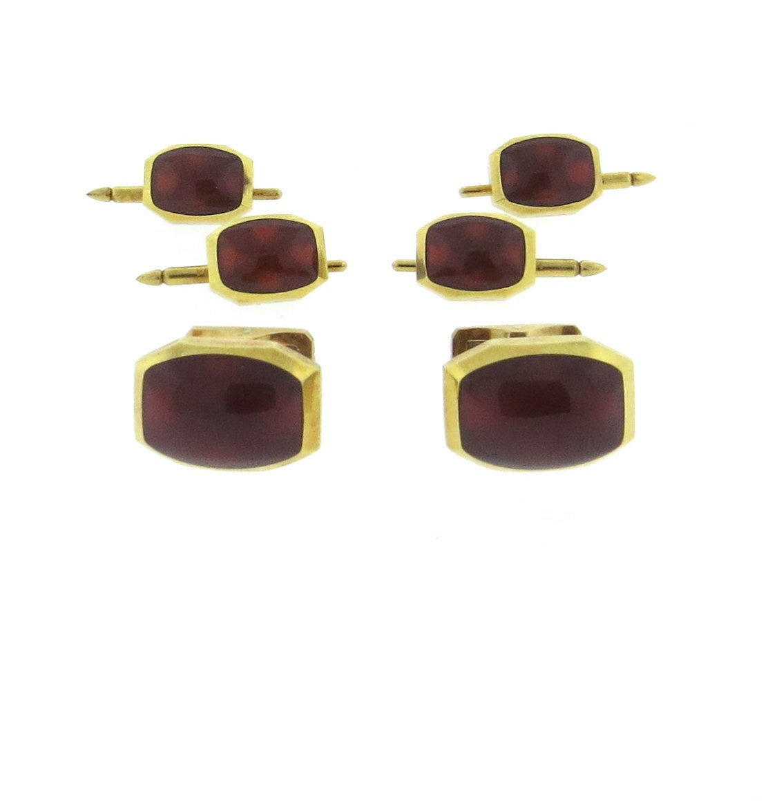 18k gold tuxedo set by Kurt Wayne, featuring cufflinks and studs. Cufflink top measures 20mm x 14mm, stud top measures 14mm x 10mm. Set with carnelian stones. Marked KW and 750. weight - 45 grams